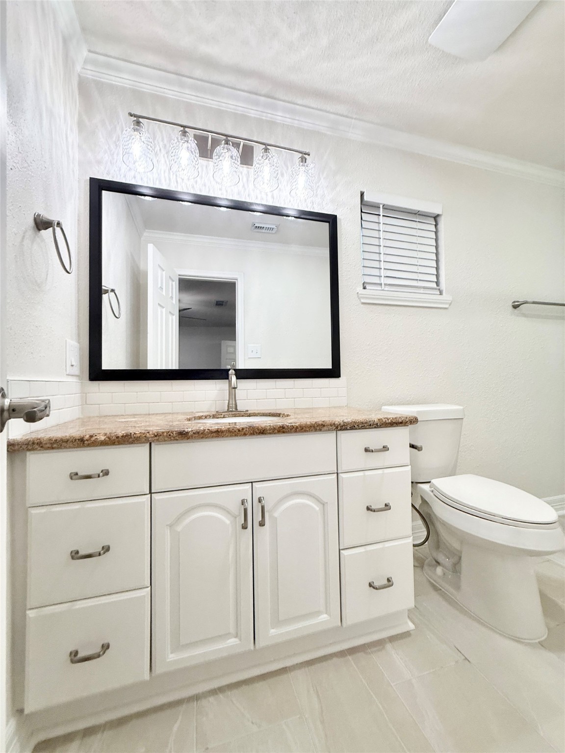 477 Oyster Creek Court Richwood, TX 77531 - Photo 15 of 33 a bathroom with a toilet sink and mirror