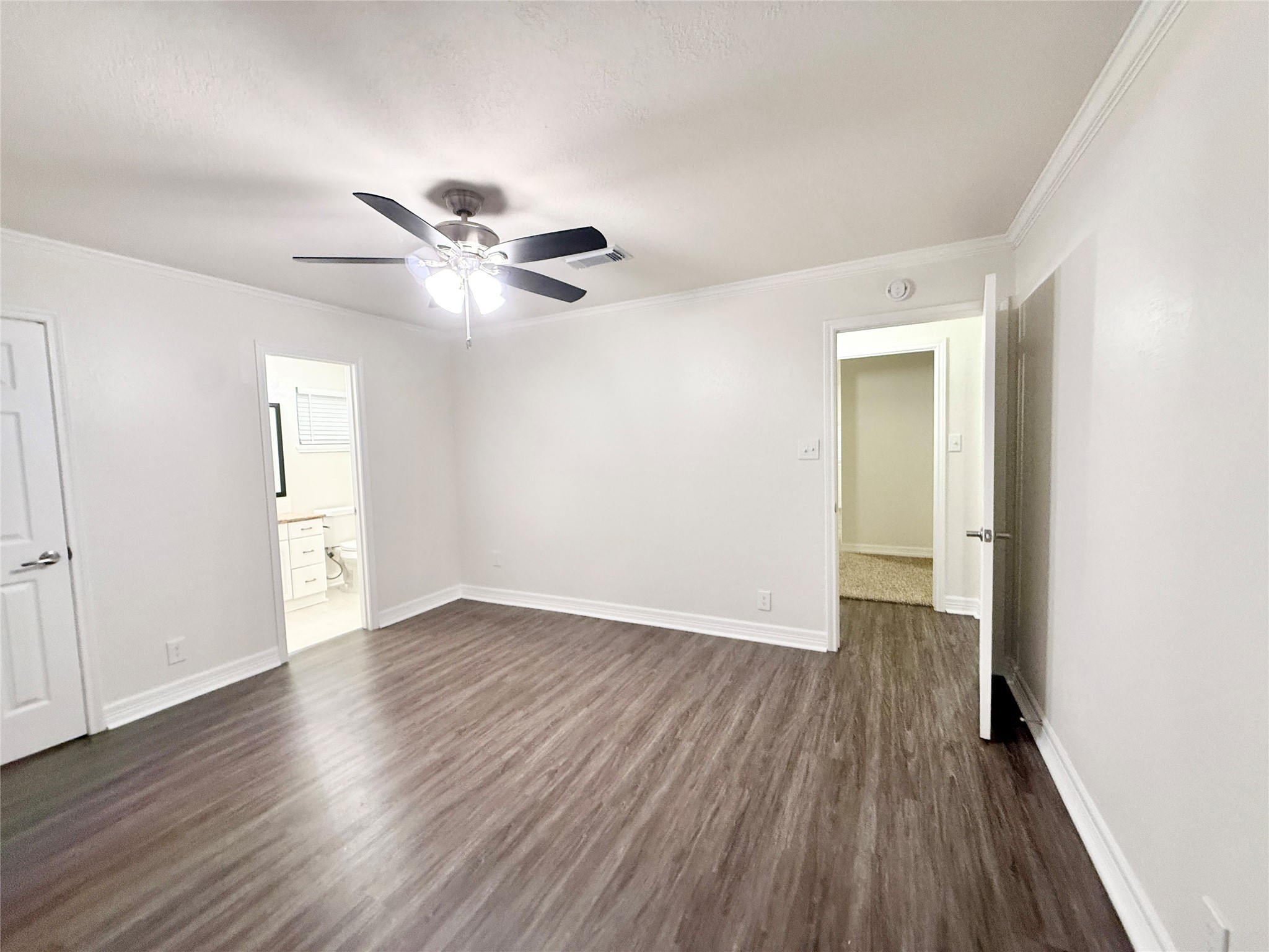 477 Oyster Creek Court Richwood, TX 77531 - Photo 21 of 33 an empty room with wooden floor and a ceiling fan