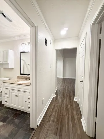 a view of a bathroom from the hallway