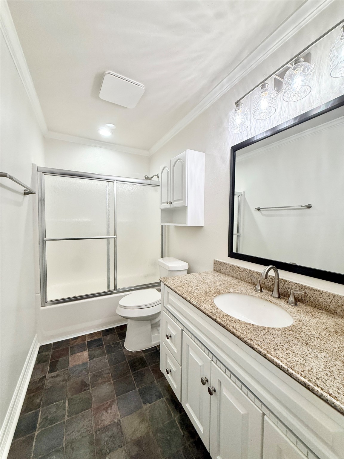 477 Oyster Creek Court Richwood, TX 77531 - Photo 28 of 33 a bathroom with a granite countertop sink toilet and mirror
