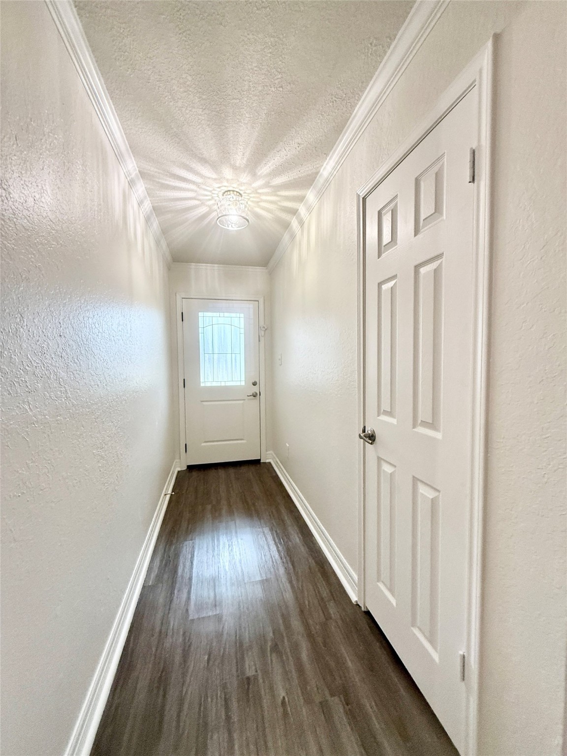 477 Oyster Creek Court Richwood, TX 77531 - Photo 3 of 33 a view of an empty room with wooden floor and a window