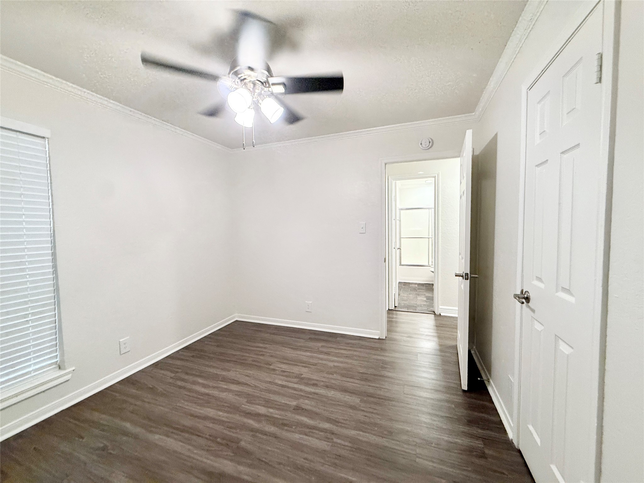 477 Oyster Creek Court Richwood, TX 77531 - Photo 32 of 33 wooden floor in an empty room with a window