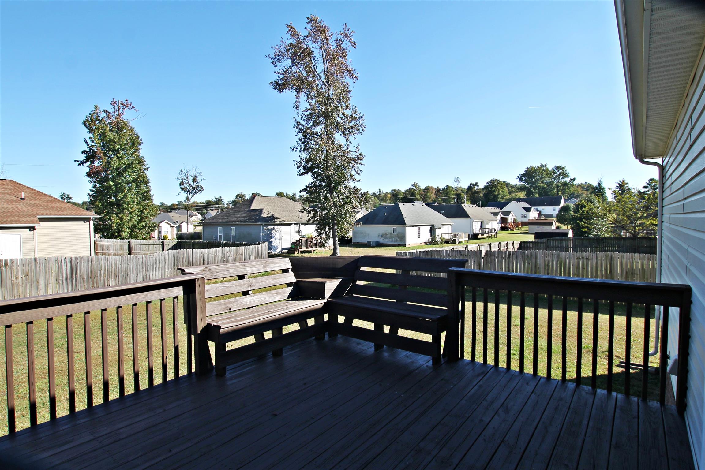 135 Filly Lane Springfield, TN 37172 - Photo 14 of 15 a view of a balcony with wooden floor and outdoor seating