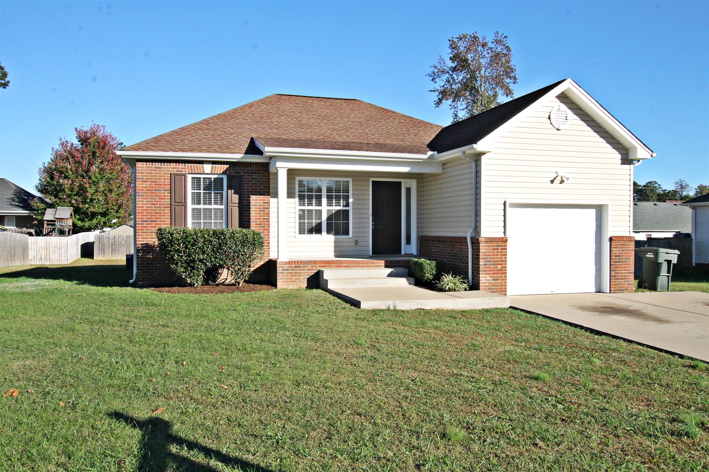 135 Filly Lane Springfield, TN 37172 - Photo 2 of 15 a front view of a house with a yard and garage