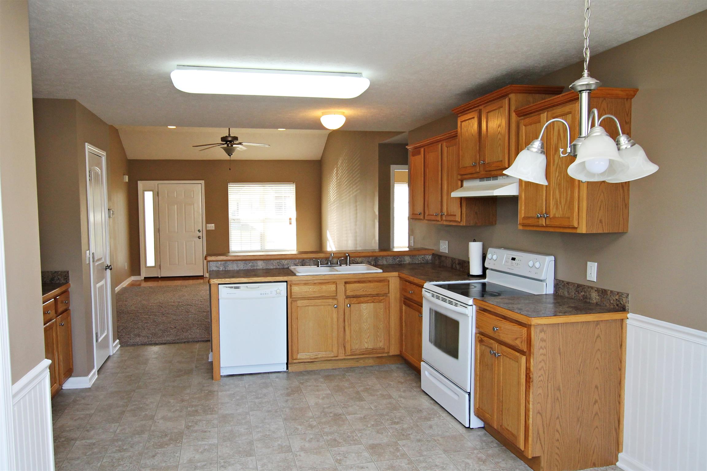135 Filly Lane Springfield, TN 37172 - Photo 7 of 15 a kitchen with stainless steel appliances granite countertop a sink a stove and a refrigerator