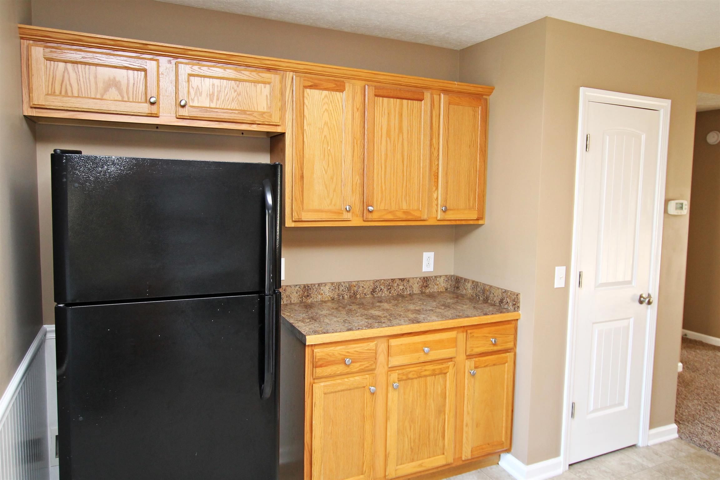 135 Filly Lane Springfield, TN 37172 - Photo 8 of 15 a kitchen with a refrigerator and cabinets