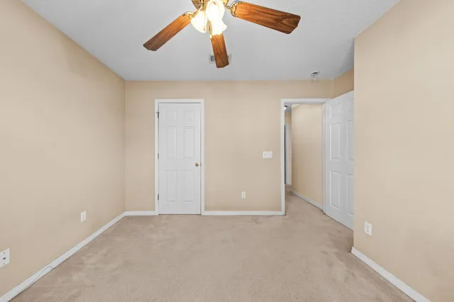 a bathroom with a sink a toilet a mirror and shower