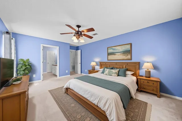 a bathroom with a granite countertop sink a large mirror and a shower