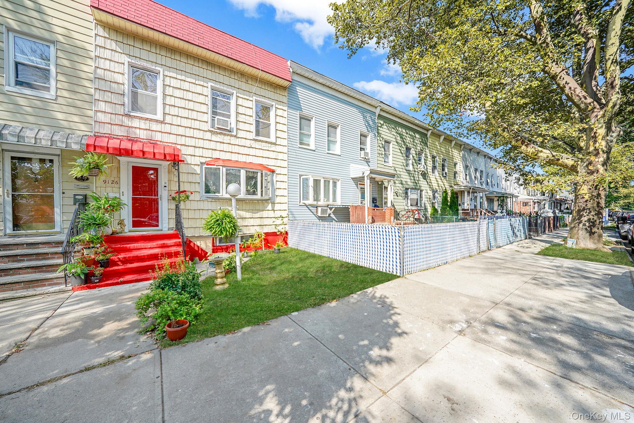 91-26 110th Street Queens, NY 11418 - Photo 2 of 25 a front view of house with yard