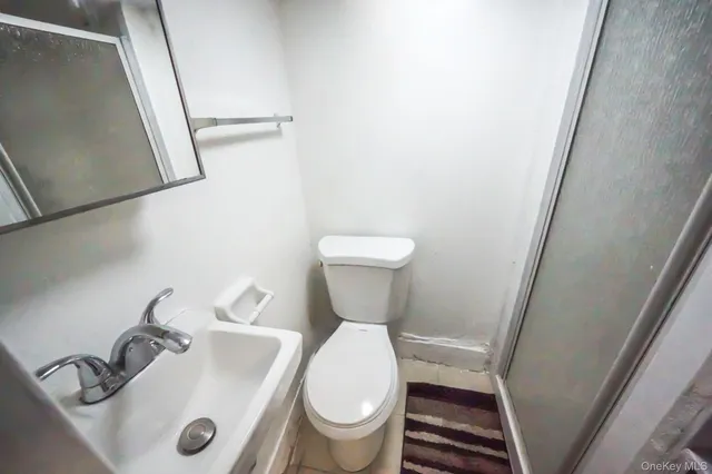 a bathroom with a toilet and a sink