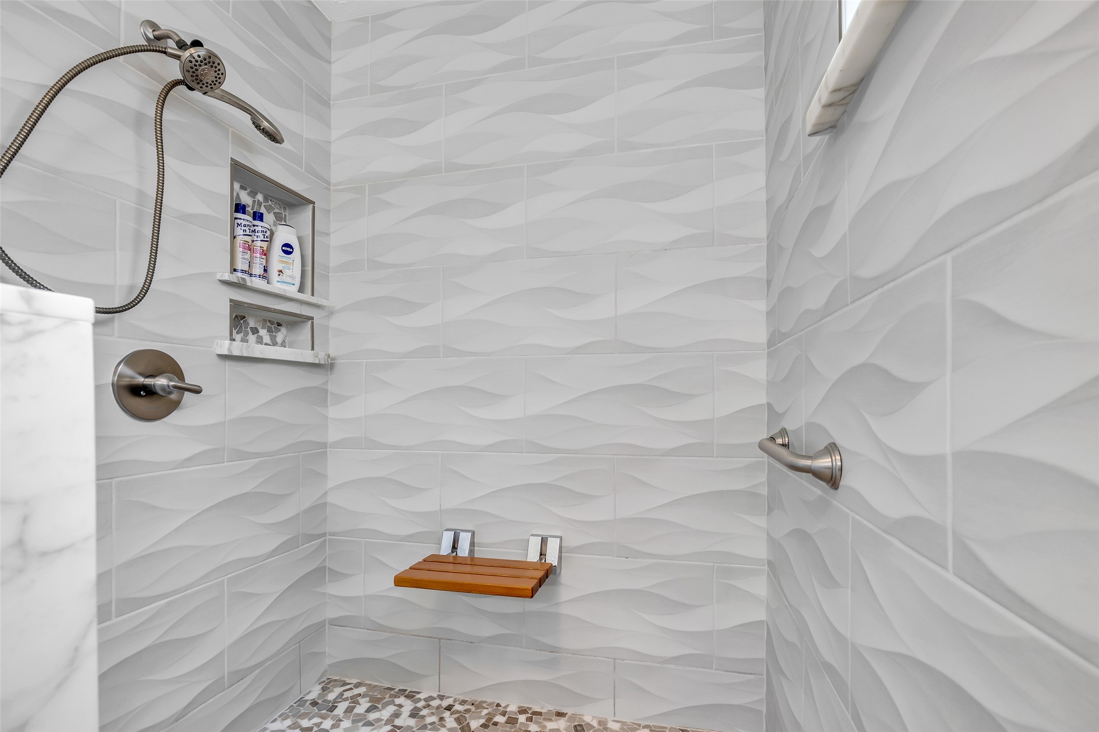 17314 Chapel Pine Street Spring, TX 77379 - Photo 32 of 44 Gorgeous wave tiles in this large shower with a bench and shelf for your personal items.