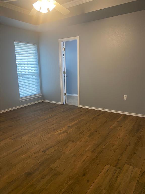 150 Hunters Circle Weatherford, TX 76088 - Photo 19 of 25 an empty room with wooden floor and windows