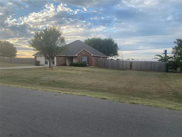 a view of a house with a big yard