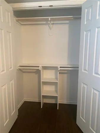 a view of an empty walk in closet