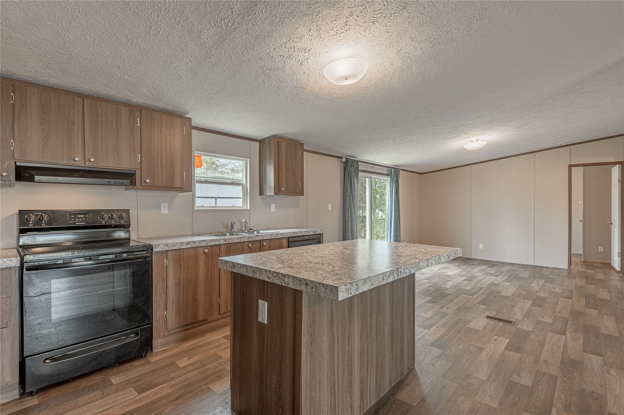 531 Canal Drive Point Blank, TX 77364 - Photo 14 of 49 Island has electrical plugs for added convenience. Look how much room you have for the dining area just off the kitchen.
