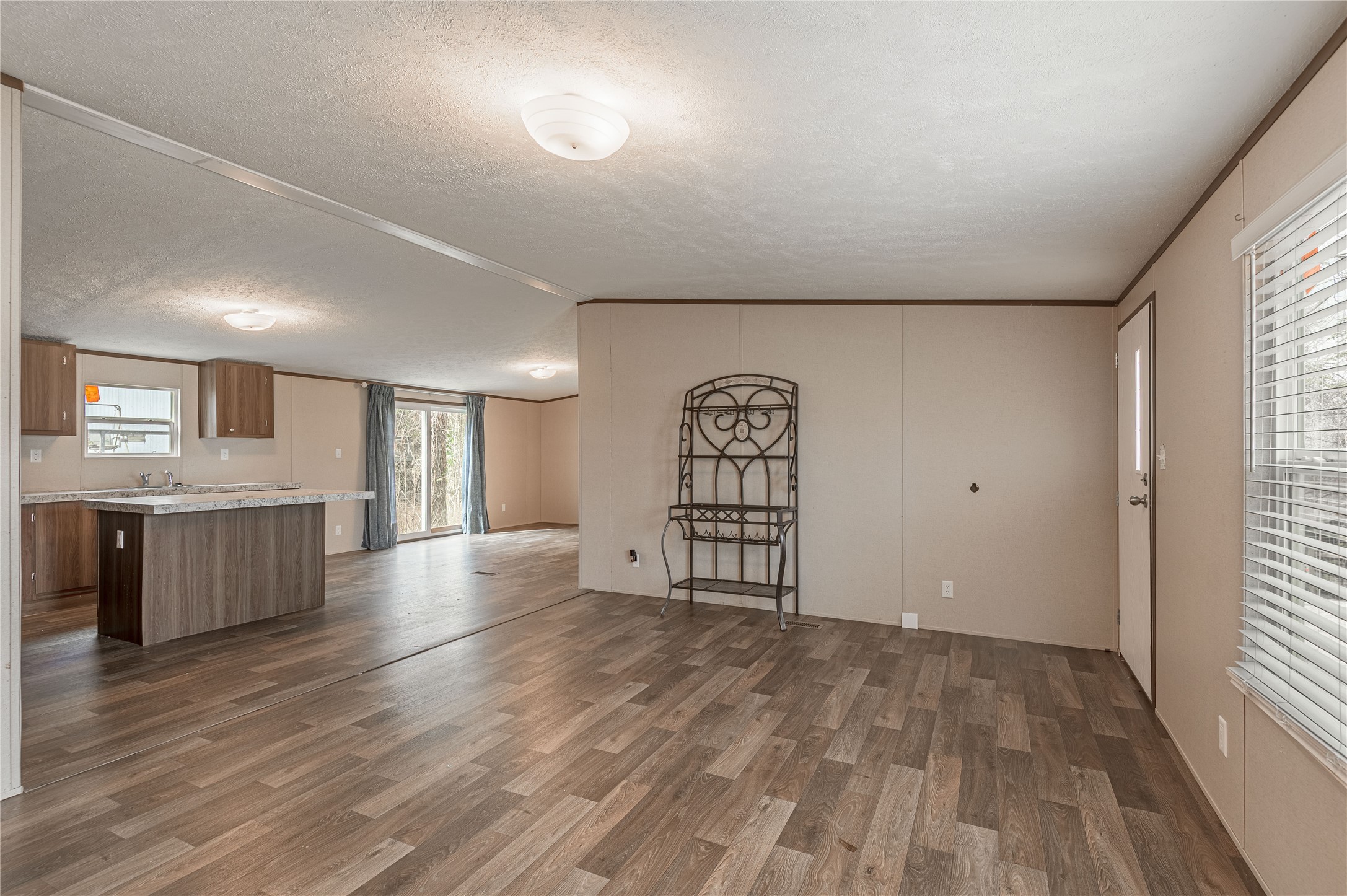531 Canal Drive Point Blank, TX 77364 - Photo 10 of 49 Living room looking towards the kitchen and dining area.