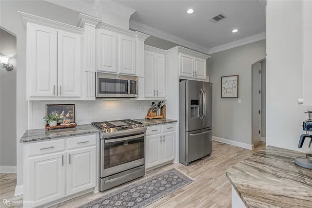 a kitchen with a stove microwave and refrigerator