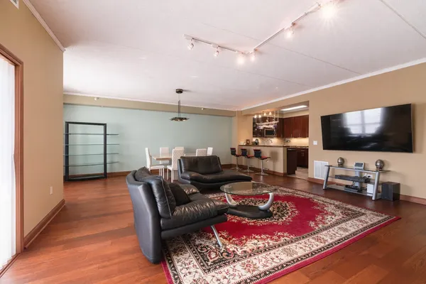 a living room with furniture and a flat screen tv