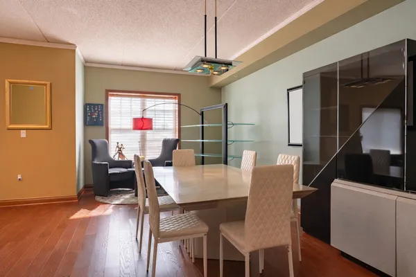 a view of a dining room with furniture window and wooden floor