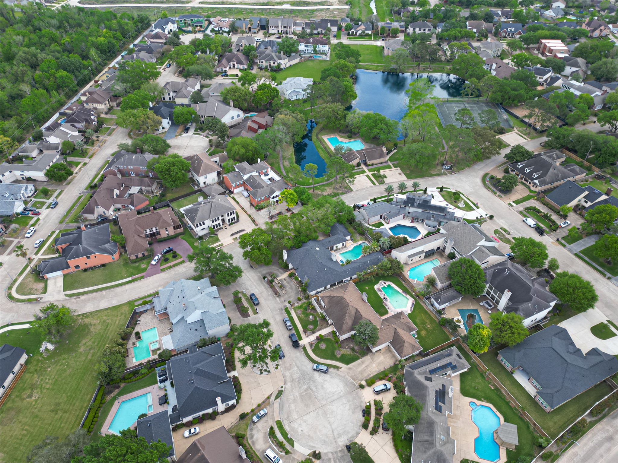 8103 Lake Edge Court Houston, TX 77071 - Photo 47 of 48 Elevated aerial capturing the home’s placement within a quiet cul-de-sac near the community lake