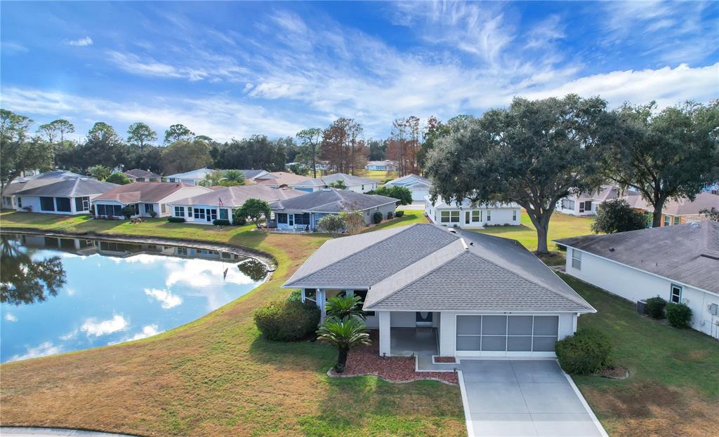 32801 Oak Park Drive Leesburg, FL 34748 - Photo 1 of 46 a view of a swimming pool in front of the house