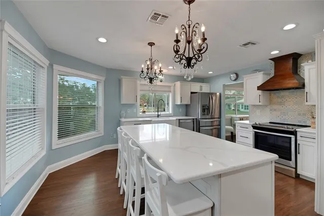 a kitchen with a counter space cabinetry and stainless steel appliances