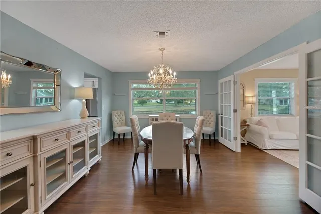 a living room with furniture a window and a flat screen tv