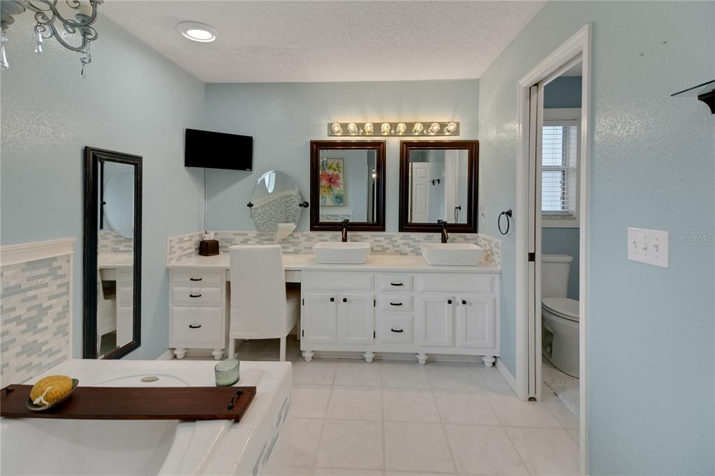 32801 Oak Park Drive Leesburg, FL 34748 - Photo 35 of 46 a bathroom with a sink double vanity and a mirror