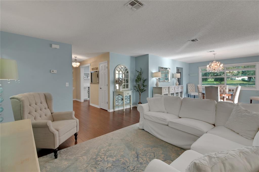 32801 Oak Park Drive Leesburg, FL 34748 - Photo 44 of 46 a living room with furniture and a large window