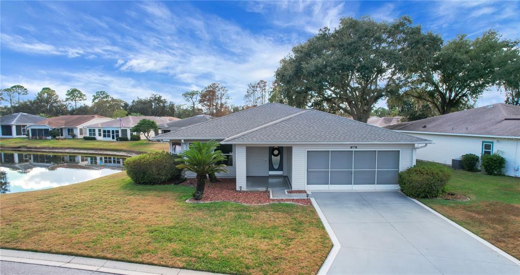 32801 Oak Park Drive Leesburg, FL 34748 - Photo 5 of 46 front view of a house with a yard