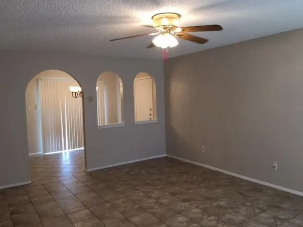 wooden floor in a hall with a window