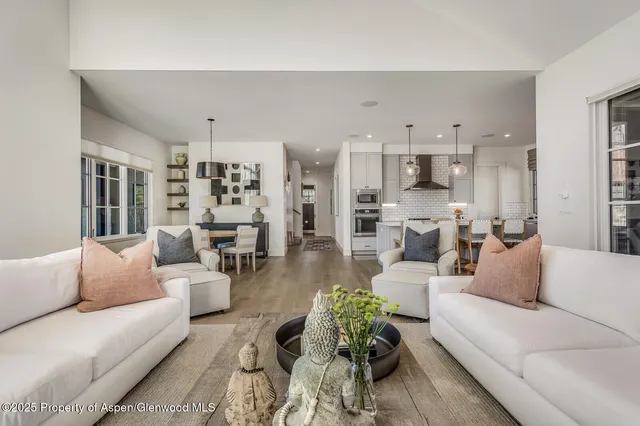 a kitchen with granite countertop a sink a counter space appliances and cabinets