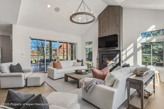 a kitchen with a center island a counter space stainless steel appliances and cabinets