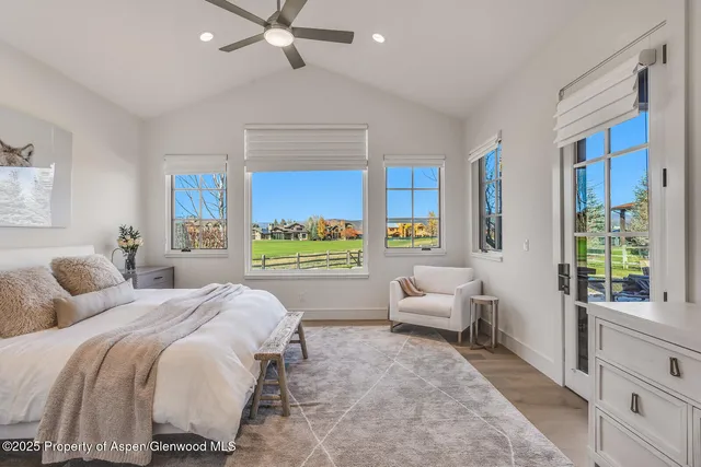 a view of a balcony with chairs and a table