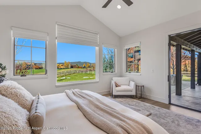 a view of a livingroom with furniture and a potted plant