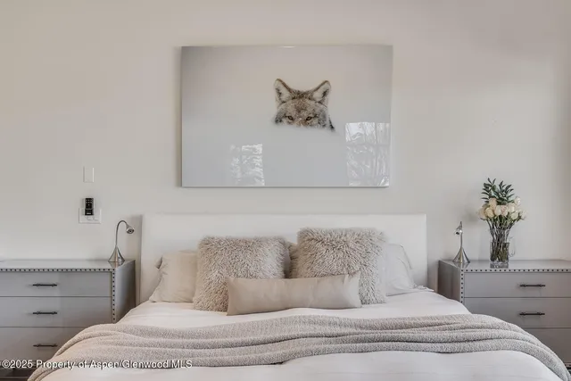 a view of a hallway with wooden floor and windows