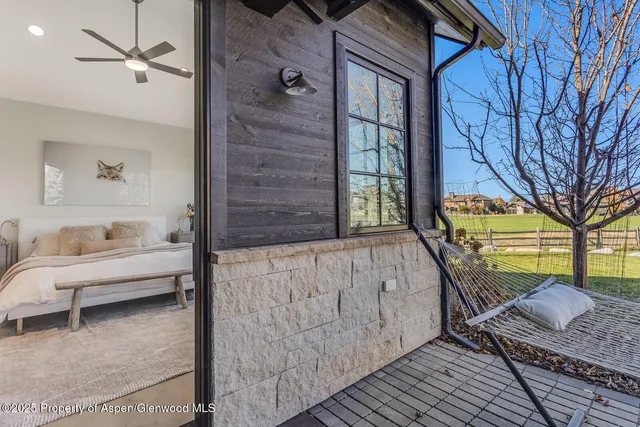 a living room with furniture and a rug