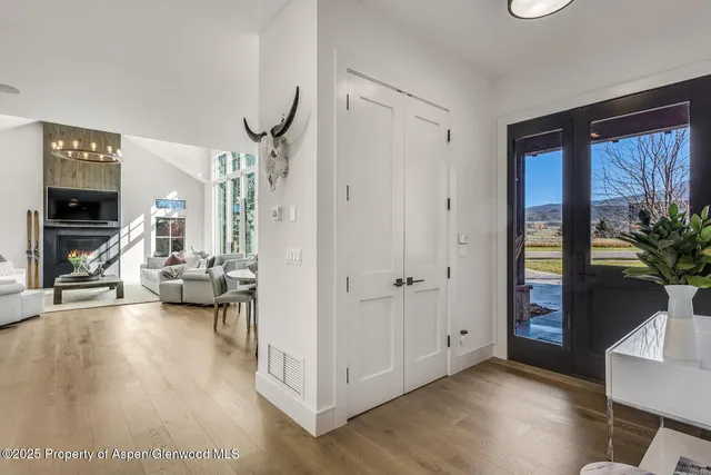 a bathroom with a shower sink vanity mirror and toilet