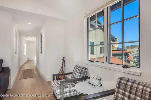a bedroom with a bed gym equipment and a window