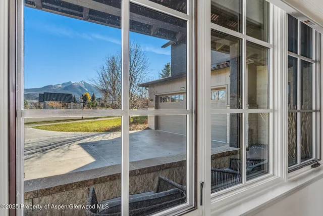 a view of an outdoor dining space with a patio