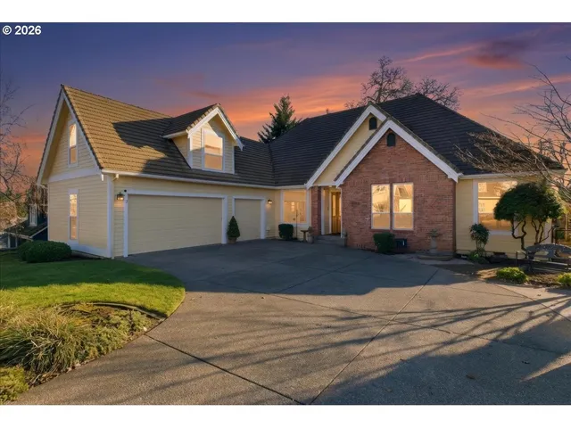 a view of house with yard