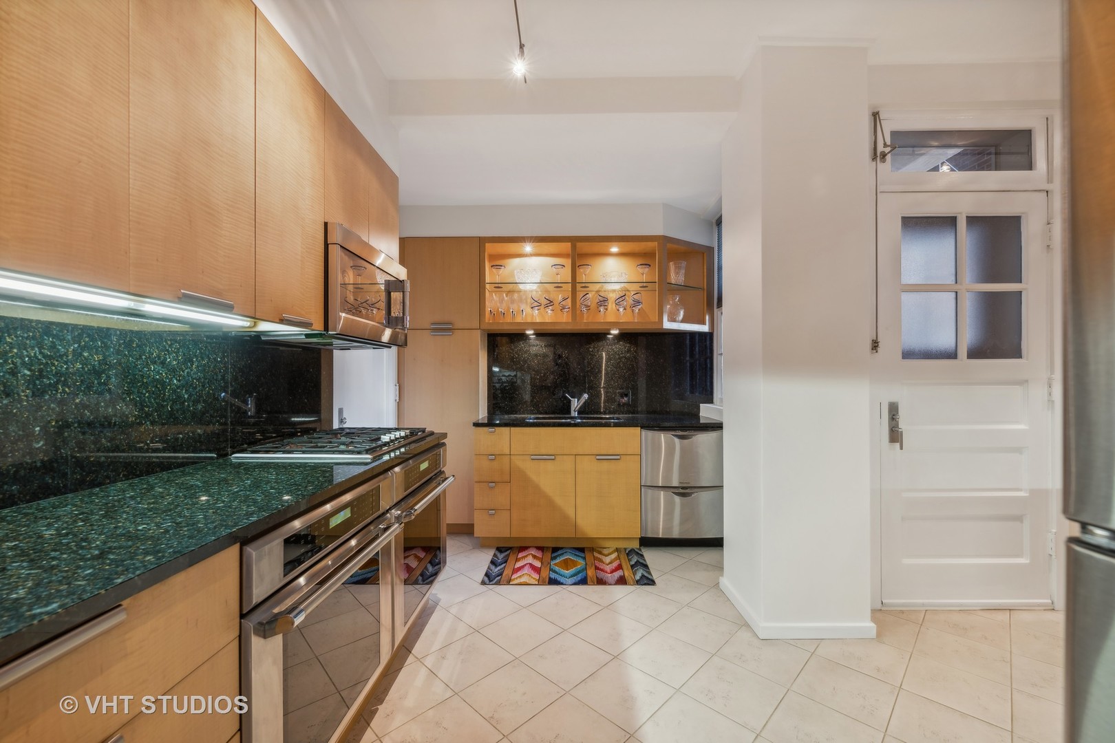 1426 Chicago Avenue, Unit 2N Evanston, IL 60201 - Photo 11 of 32 a kitchen with a sink and a stove top oven