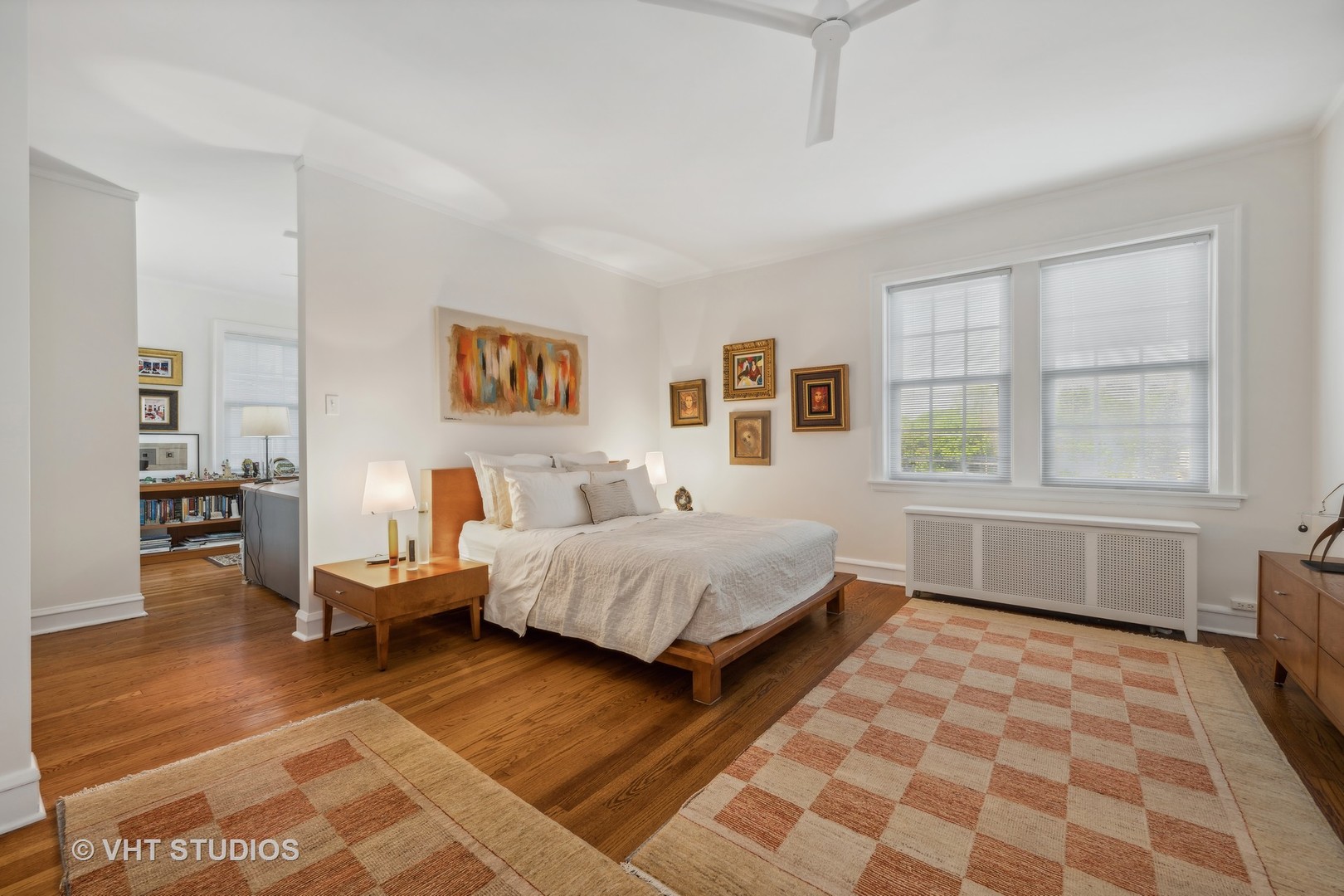 1426 Chicago Avenue, Unit 2N Evanston, IL 60201 - Photo 14 of 32 a spacious bedroom with a bed and wooden floor