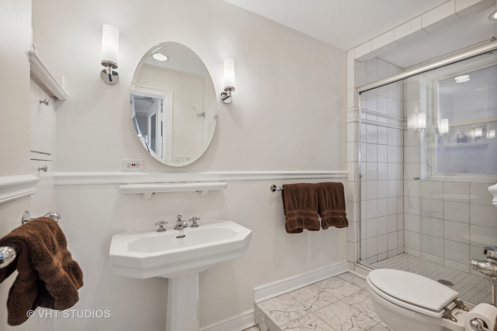 1426 Chicago Avenue, Unit 2N Evanston, IL 60201 - Photo 18 of 32 a bathroom with a sink a toilet and shower