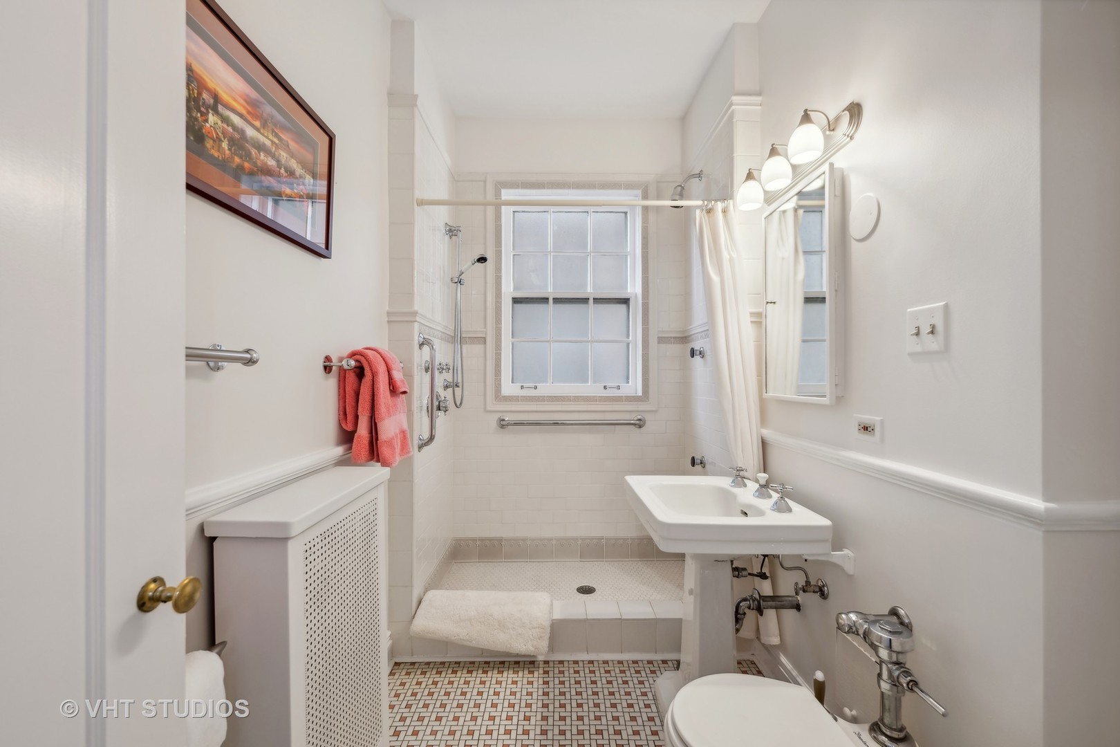 1426 Chicago Avenue, Unit 2N Evanston, IL 60201 - Photo 19 of 32 a bathroom with a sink a toilet and shower