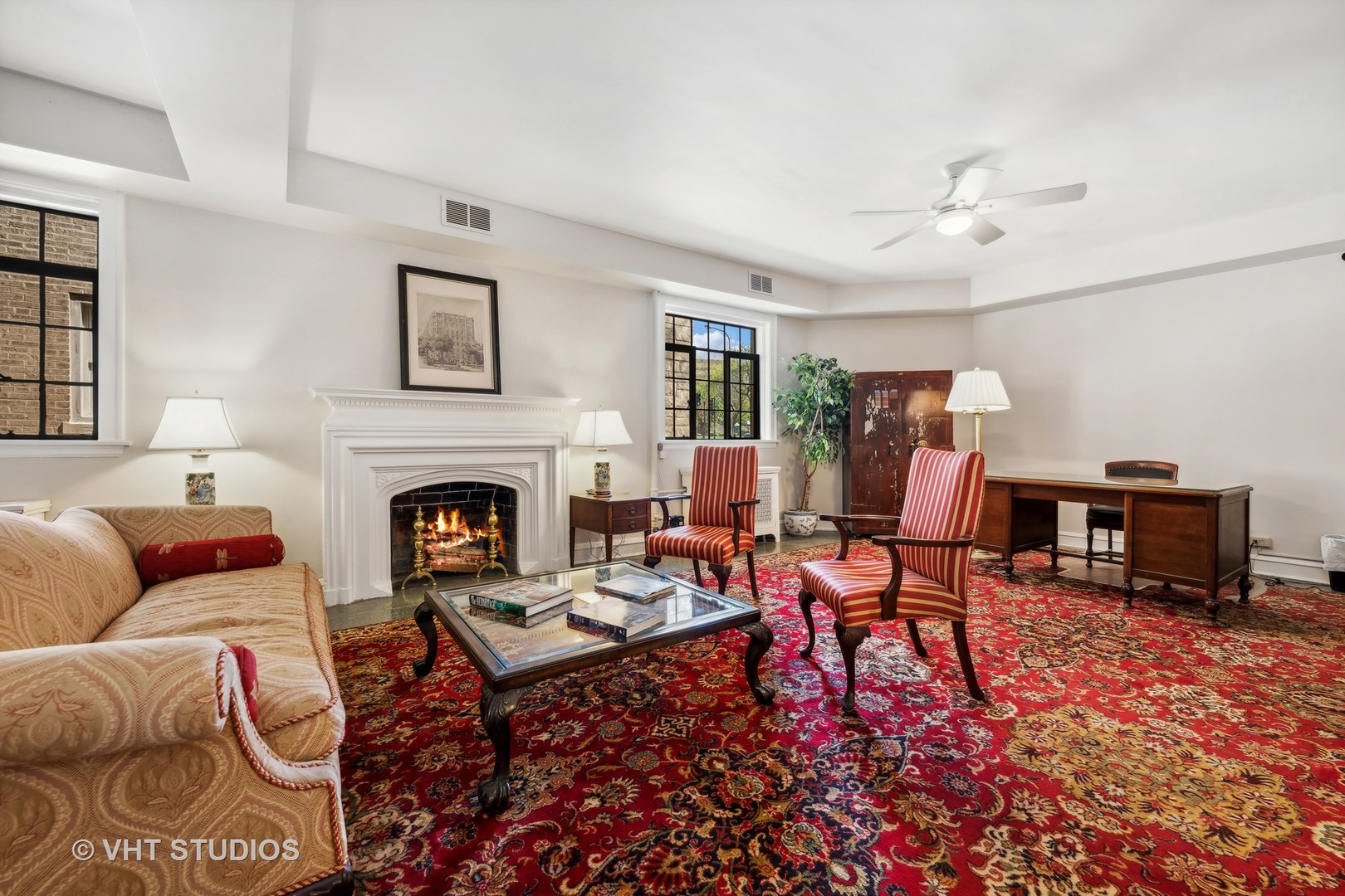 1426 Chicago Avenue, Unit 2N Evanston, IL 60201 - Photo 21 of 32 a living room with furniture a fireplace and a table