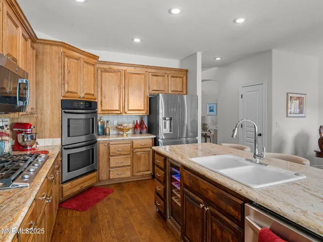 a kitchen with a sink stove and refrigerator