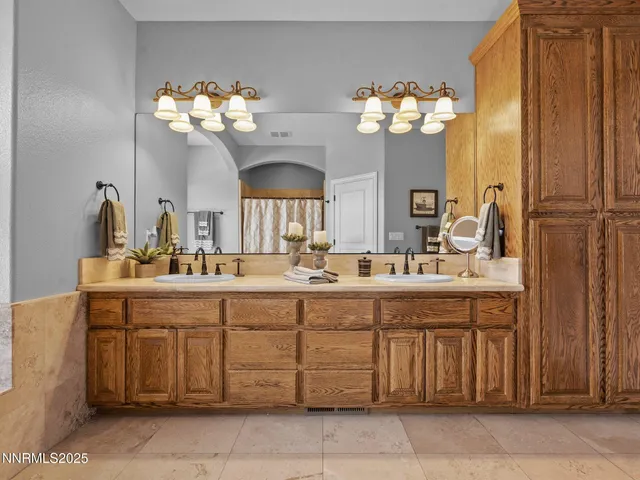 a bathroom with a sink vanity and a mirror