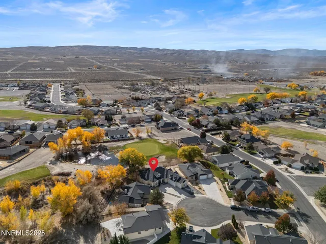 a view of a city with mountains in the background