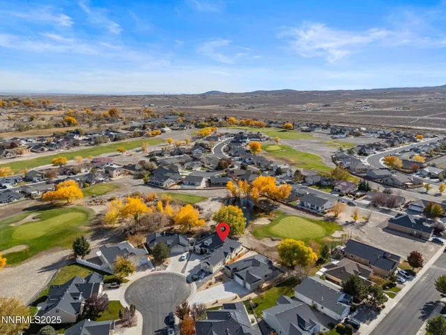an aerial view of residential building and lake